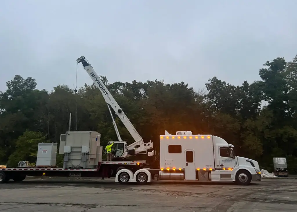 Boom truck offloading HVAC units in Dubois, PA with a boom truck