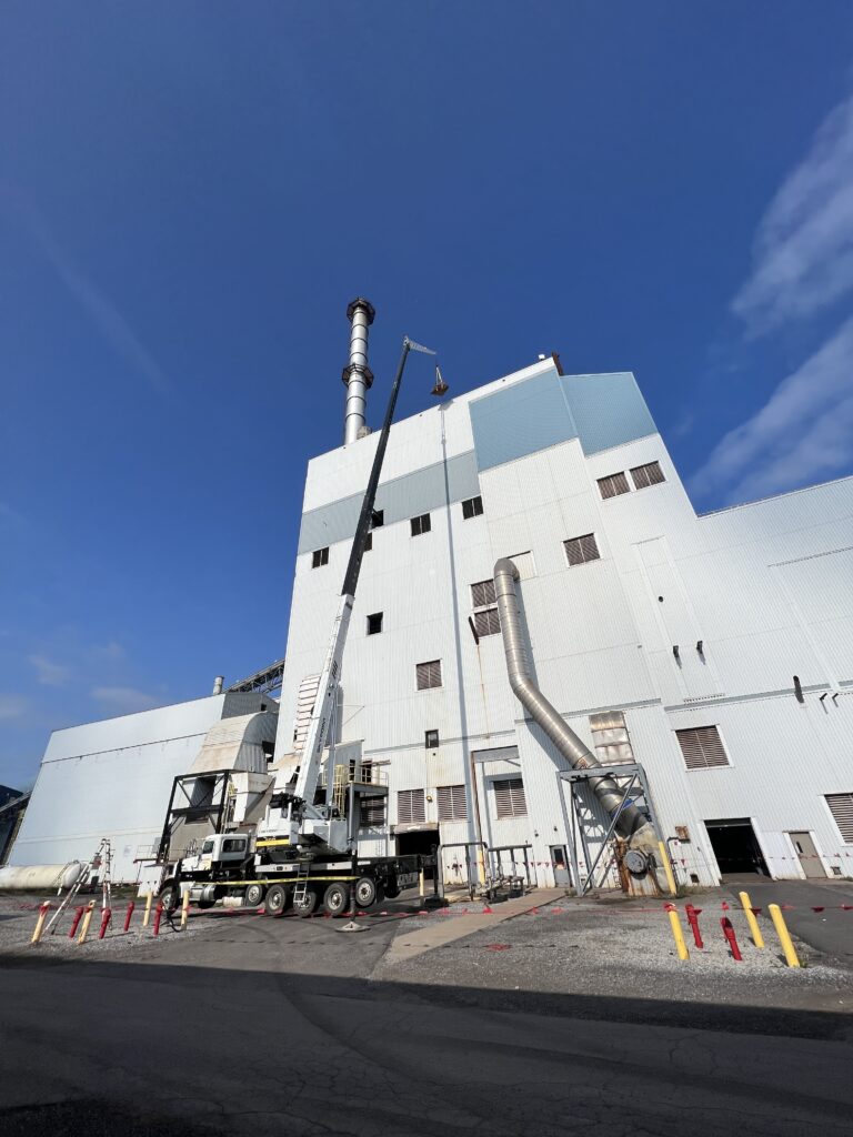 Sky Point Crane hydraulic truck crane performing lift at manufacturing plant in Ford City PA